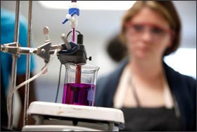 Senior Sarah Marquardt works on her titration experiment in the same AP chemistry class.