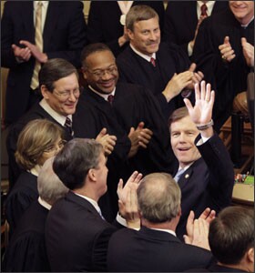 Virginia Gov. Robert F. McDonnell waves to his wife as he arrives for his State of the Commonwealth address, in Richmond. In a year when lawmakers and governors in many states are facing tough budget choices, Gov. McDonnell has proposed having state employees contribute 5 percent of their salaries toward their pensions; Virginia is one of a handful of states to carry the full cost of state pensions.