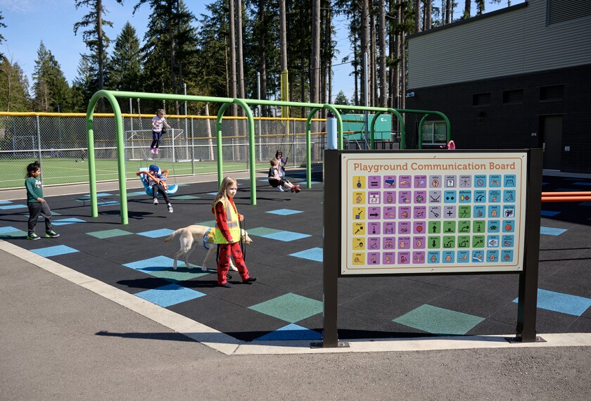 During recess at Ruby Bridges Elementary School in Woodinville, Wash., students have cards with objects and words on them so that all students, including those who cannot speak, can communicate. Pictured here on April 2, 2024.