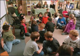 3rd grade teacher Jenny Nash teaches a mini-lesson as other teachers observe.