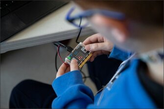 A 7th grader at Rocky Top Middle uses a microcontroller, which is controlled through a dashboard on the student’s laptop.