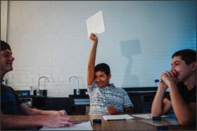 Omar Chavarria holds up an answer to a math problem in class at Valley Point. The school’s enrollment became “majority minority” in the 2013-14 school year.