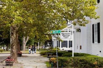 A group of teenagers walks through Newtown, Conn., Thursday, Aug. 18, 2022.