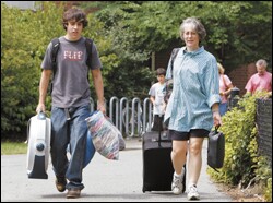 Andrew Sargent, 16, who will be a junior this fall at Henderson High School in West Chester, Pa., arrives for camp at Tufts University with his mother, Nancy.