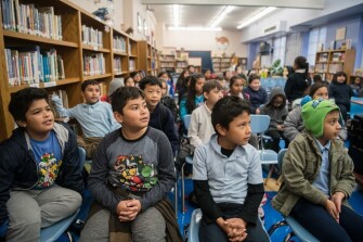 From left, students Ayden Hernandez, Joshua Castro, Max Lopez, and Adonay Miranda participated in a classroom exercise held in the library at Vine Street Elementary while their teachers were on strike.