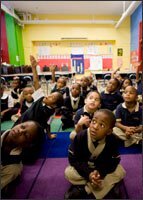Kindergarteners listen as their teacher reads aloud at North Star Academy in Newark, N.J., a city whose charter school sector is enjoying rising political and financial support.