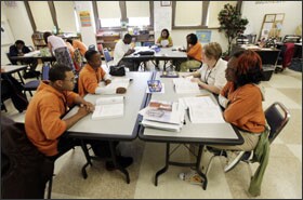 YouthBuild Indy students study for the test leading to a General Educational Development certificate. Students alternate each week between the classroom and on-site construction work.