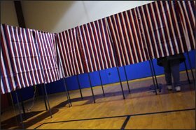 A voter casts a ballot in Seabrook, N.H., during the nation’s first presidential primary.