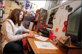 Ellie Brems, 14, of Coshocton, Ohio, takes notes during an online class she was attending from her family’s basement, which serves as a learning space for the Brems children.