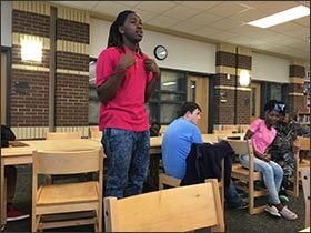 Eighth-grader Tamari Ladson, standing, classmate Riziki Nizeyimana, at far right, and other students say that while they are proud of the new Dillon Middle School and their community, they still need art classes, more foreign languages and better opportunities to prepare for college.