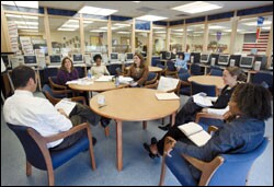 Courtney Sheppeck, second from left, prepares a group of teachers at the Murphy School for what they will see in her English classroom.