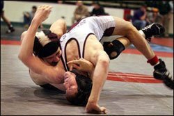 Tournament wrestlers locked in competition.