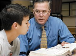 Gov. Jeb Bush mentors 8th grader Anthony Pedersen at Raa Middle School in Tallahassee, Fla., on Feb. 23, the same day Mr. Bush unveiled a reform package.
