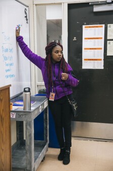 Rochelle talks with the poetry slam team after school about what food they want to sell at an upcoming event. She is the co-captain and will be the captain her senior year.