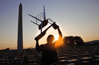 Omarae Pena dismantles the installation.