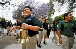 Alex Velarde rings the morning bell at Gompers Charter Middle School. Early signs indicate that the newly independent school is off to a good start, but its experience suggests that the charter route may not be an easy one for public schools required to restructure under the federal law.