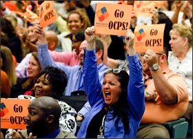 Dorina Sackman, front right, the Florida Teacher of the Year for 2014, joins her Orange County public school colleagues in Orlando last week in cheering their district’s selection for the Broad Prize for Urban Education.