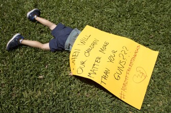 Remy Ragsdale, 3, attends a protest organized by Moms Demand Action on Wednesday May 25, 2022, at the Governor's Mansion in Austin, Texas, after a mass shooting at an elementary school in Uvalde.