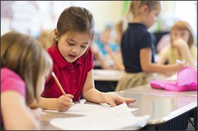 Aubrey Eisele, a 1st grade student at Hatton, works on a root-word exercise during class.