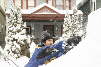 Al Antolin clears his car of snow Saturday, Nov. 19, 2022 in Buffalo, N.Y.
