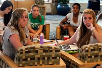 Penn State University students gather around a television in the student union on the school's main campus to listen to a press conference held by former FBI Director Louis Freeh. He issued a report chronicling administrators' failure to protect children in the child sex-abuse scandal connected to the university's storied football program.