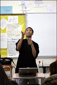 Ninth grader Marvin Mungo launches a Slinky during a class on wave behavior.