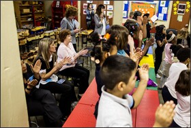 Educators and officials from both districts observe a music class at Nashville's Eakin Elementary School.