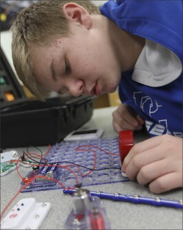 Zach Heidenwith, 14, works on Snap Circuits in a STEM class at Putnam County High.