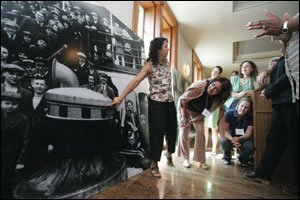 Claudia Ocello, Save Ellis Island’s associate director of education and public programs, shows instructors how to identify the significance of exhibits’ details.