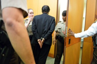Former Deerwood Academy assistant principal Tabeeka Jordan is led to a holding cell after a jury found her guilty in the test-cheating trial.