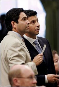 Assemblyman Dario Frommer, D-Glendale, left, and Assembly Speaker Fabian Nunez, D-Los Angeles, watch as the votes are posted on Nunez's measure, to give Los Angeles Mayor Antonio Villaraigosa greater control over the Los Angeles Unified School District, during the Assemby session held at the Capitol in Sacramento, Calif., Tuesday, Aug. 29, 2006.