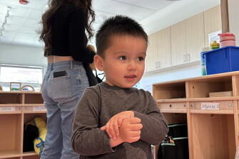 Mateo Arambula waits for his mother, Marisshia Sigala, to collect his things as she picks him up from Koala Children's Academy after a day of work in Albuquerque, New Mexico, on March 20, 2024.