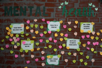 Notes from students expressing support and sharing coping strategies paper a wall, as members of the Miami Arts Studio mental health club raise awareness on World Mental Health Day, Oct. 10, 2023, at Miami Arts Studio, a public 6th-12th grade magnet school, in Miami.