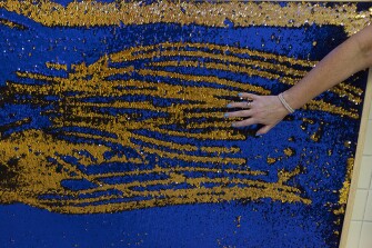 Student Council advisor Amy Daniel demonstrates a sensory wall at Western Branch Middle School in Chesapeake, Va., on Sept. 21, 2021.
