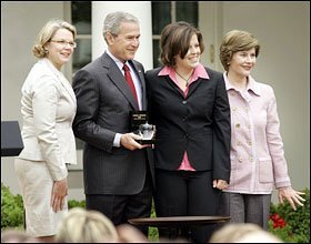 Andrea Peterson of Granite Falls, Wash., the 2007 National Teacher of the Year, second from right, poses with, from left, Education Secretary Margaret Spellings, President Bush and first Lady Laura Bush in the White House Rose Garden.