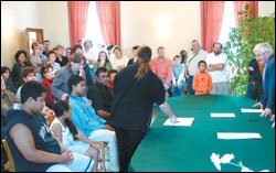 In the town hall of Courmelles, a village south of Soissons, teachers and other members of an immigrant-protection group symbolically sponsor Dominique Razafisaona, in blue, and his sibilings in a citizenship ceremony dating to the French Revolution.