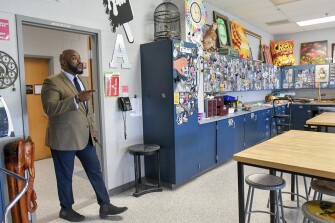 Principal Michael C. Brown, left, chats with art teachers at Winters Mill High School in Westminster, Md., on May 17, 2022.