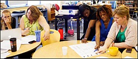 In a meeting at Watkins Elementary School last month, teachers from Stuart-Hobson Middle School comb through data from last spring's DC CAS test.