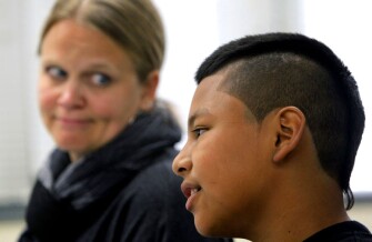 Assistant principal Kristy Treewater, left, watches as Danny Perez, a 7th grader at Davidson Middle School in San Rafael, Calif., answers questions in peer court.
