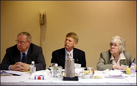 From left, Seth Adams, Scott Turney, and Claudette Morton, members of the National Rural Education Association, listen at the group's legislative forum in Arlington, Va.