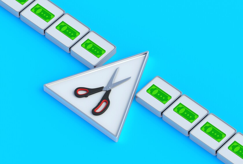 Conceptual money icon and scissors on buttons. Distribution of budget funds. Business concept.