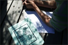 A student at Sunnyvale Middle School reviews a document illustrating the types of restraints used on American slaves.