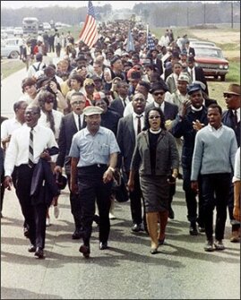 Martin Luther King with his wife, Coretta Scott King, lead a march from Selma to Montgomery, Ala., in March, 1965.