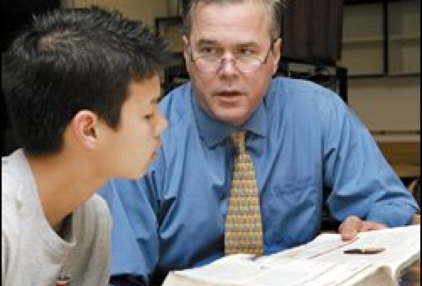 Gov. Jeb Bush mentors 8th grader Anthony Pedersen at Raa Middle School in Tallahassee, Fla., on Feb. 23, the same day Mr. Bush unveiled a reform package.