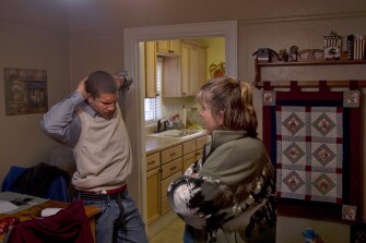 Mr. Davis talks with his mother, Stephanie, at their home near downtown Cheyenne.