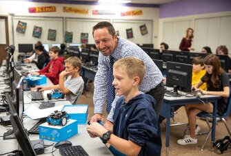 Breen visits an advanced technology class at Old Vail Middle School in Vail, Ariz. He is leading an effort to integrate computer science into courses across the district.