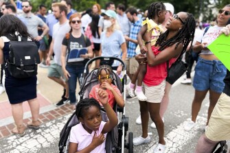 Nadia Brown and her children Nile, Nuri and Neva Brown Lawrence attend a demonstration outside the Supreme Court on June 24, 2022.