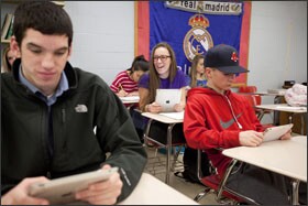 Burlington High School in Massachusetts emphasizes the use of iPads, rather than textbooks, for students to read material for their classes.