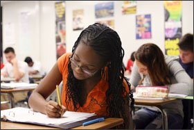 College Prep: Victoria Esiobo, 16, a 10th grader at Cooper City High, works on a trigonometry assignment. The school receives feedback on how its students fare in college classes.