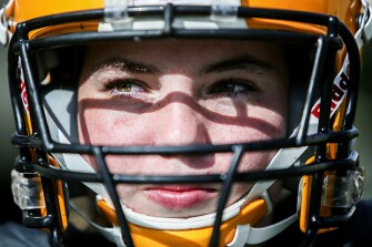 “This shows anyone can do anything they want,” Michael says of her dual role as football player and school band member.
